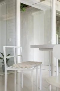 A minimalist interior featuring concrete elements and clean lines