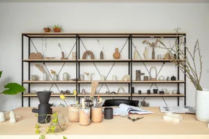 A collection of ceramic furniture pieces arranged in an interior setting, showcasing modern design.