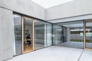 Modern interior design featuring a glass curtain in a minimalist space.