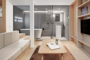 Modern residential interior with a blend of wood, glass, and concrete materials.
