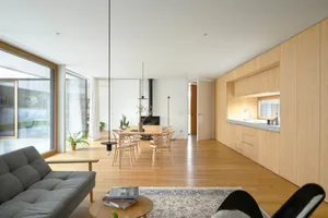 Interior design featuring a modern residential space with wooden elements and a minimalist aesthetic.