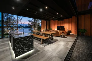 Modern living room featuring a combination of marble and wood materials.