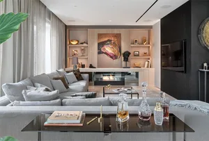 Modern living room featuring a comfortable grey sofa and minimalist decor.