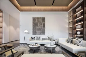 A minimalist living room with neutral tones and modern furniture.