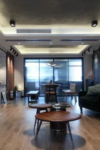 Industrial-style living room with wooden furniture and floors.