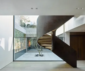 Industrial-inspired staircase made of metal in a modern interior design setting.