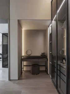 Modern, minimalist home office with wood accents and glass wall.