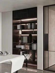 Modern minimalist bookshelf with glass and metal accents in contemporary interior design setting.