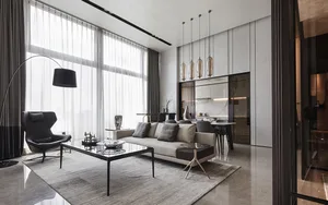 Contemporary living room featuring white marble surfaces and minimalist decor.