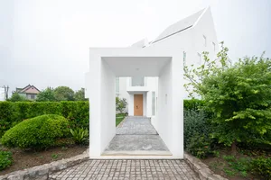 Concrete entranceway to a modern residential property.