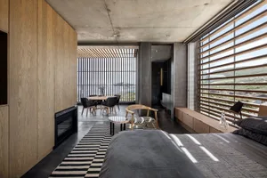 Modern bedroom with wood, glass, and concrete materials
