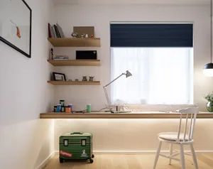 A modern home office with a wooden desk, blue curtains, and white shelves.