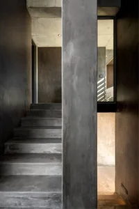 A minimalist design staircase constructed from concrete materials.