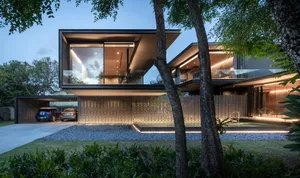 A modern house with concrete, glass, and metal materials.