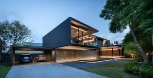 A modern house with a metal frame, glass windows, and tiled flooring.