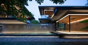A modern residential building featuring a metallic-textured exterior and a minimalist design.