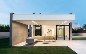 Modern residential exterior with concrete and glass materials.