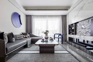 Modern living room with a large sectional sofa, marble coffee table, and abstract art on the wall.