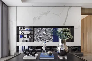 Modern interior design featuring a living room with marble finishes and contemporary decor elements.