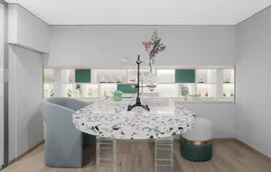 A modern laboratory office space with a marble table and glass elements.
