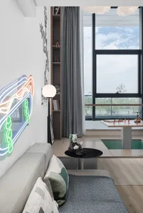 A modern living room features a comfortable sofa with a contemporary design.