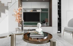 Modern minimalist living room featuring glass coffee table, metal legs, and wooden accents.