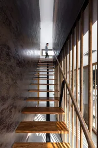 Modern wooden stairs with industrial design elements in an interior space.