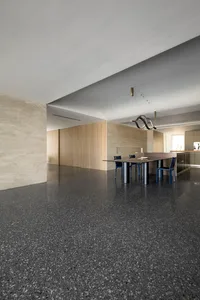 Modern dining room featuring a concrete floor and minimalist design.