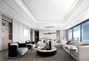 A modern living room with white and black furniture and minimalistic decor.