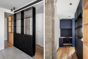 Modern home office space featuring concrete shelving and wooden floor.