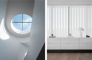 Modern interior design featuring large glass windows.