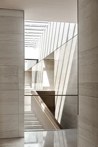 A modern interior design featuring a marble curtain wall.