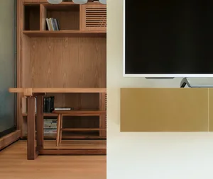 A modern interior space featuring a wooden shelving unit with books and a TV mounted on the wall.