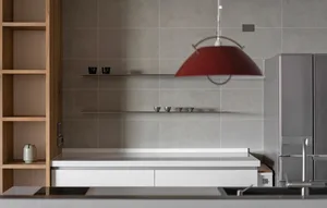 Modern kitchen with industrial design elements and a concrete finish.