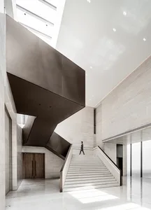 A modern lobby featuring marble and wood materials.