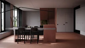 A modern living room with a terrazzo floor, black chairs, and a concrete table.