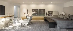 A modern minimalist living room featuring wood, glass, and fabric elements.