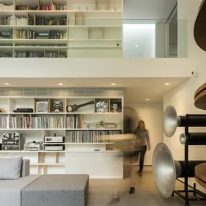 A modern living room featuring retro furniture and decor.