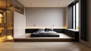 Modern minimalist bedroom featuring a platform bed with dark bedding and wooden floor, illuminated by sconces on a white wall