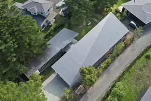 Aerial view of modern residential buildings with a metal roof