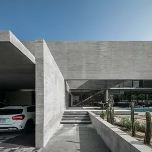 Modern house with a concrete exterior and a carport