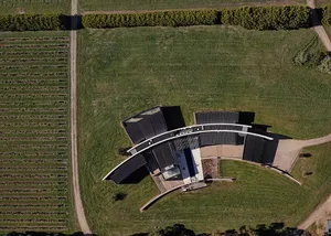 Curved glass walls of a modernist winery building