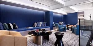 Modern corporate lounge featuring blue walls and steel furniture