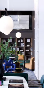 A modern living room with contemporary furniture, large windows, and minimalist decor.