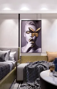 Modern minimalist bedroom with soft lighting, textured fabric bedding, and a striking artwork featuring a woman and a butterf