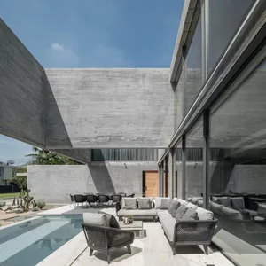 Modern minimalist house exterior with concrete and glass materials