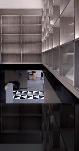 A modern library with wooden shelves illuminated by LED lights.