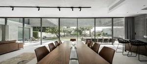 Modern residential interior featuring concrete and glass materials