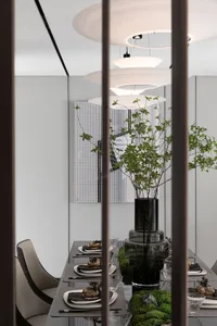 Minimalist dining room with glass vases and decorative plants