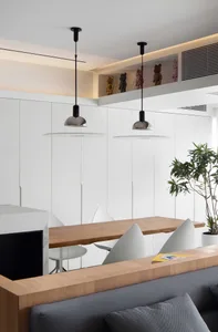 Modern interior design featuring a white wall with wood and metal elements.